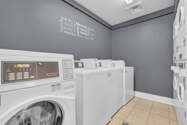 Laundry room with white machines at AVIA Lofts on Liberty Ridge, Apartments, Jacksonville, 32256